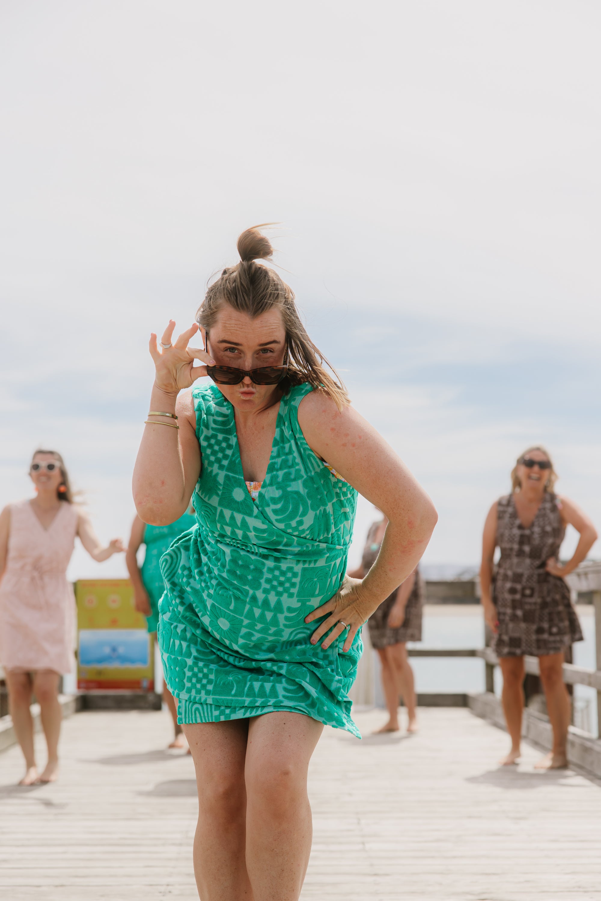 Woman wearing Sprout green terry wrap dress at the beach